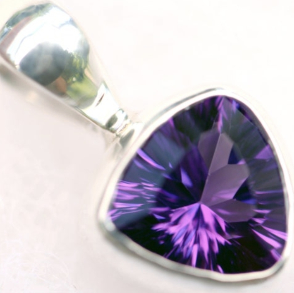 Dainty faceted amethyst sterling silver pendant.